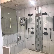 2 person shower with black faucets