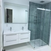 Mordern floating vanity and glass tile shower wall