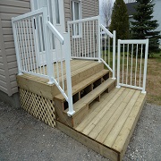 Small deck with small white railing
