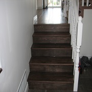Wood stairs and bullnose with white railing